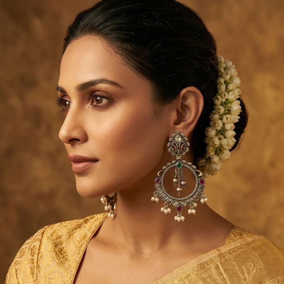 Women wearing silver dangling pearl Earrings