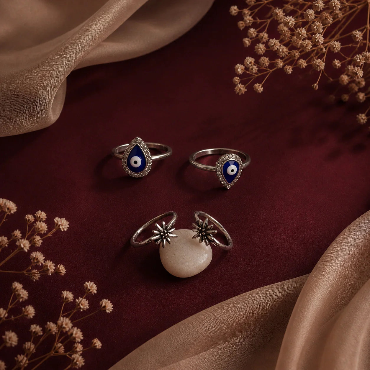 Two pairs of Toe rings flat lay image on marron background  