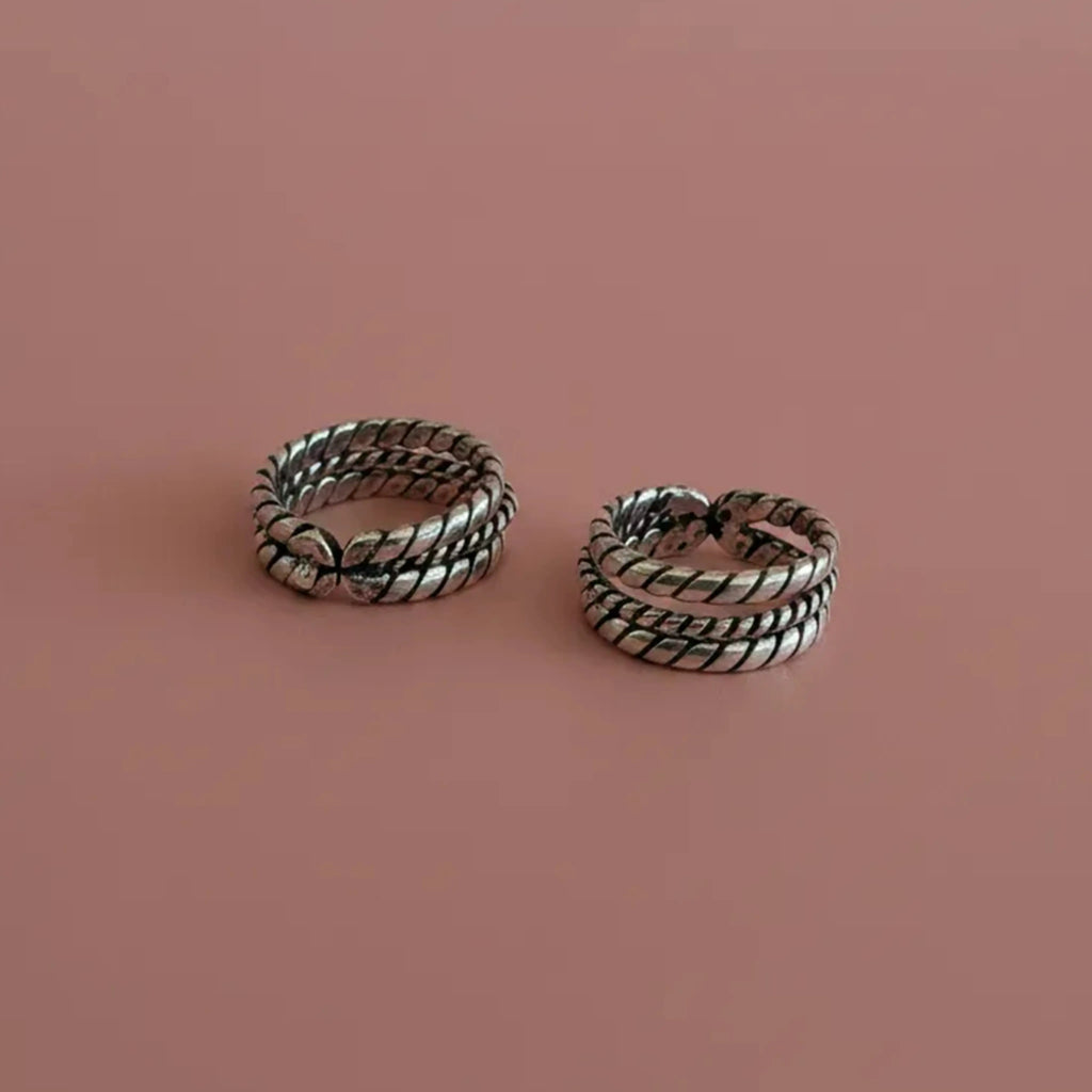 Flat lay image of Twisted Double-Rope Oxidized Toe Rings