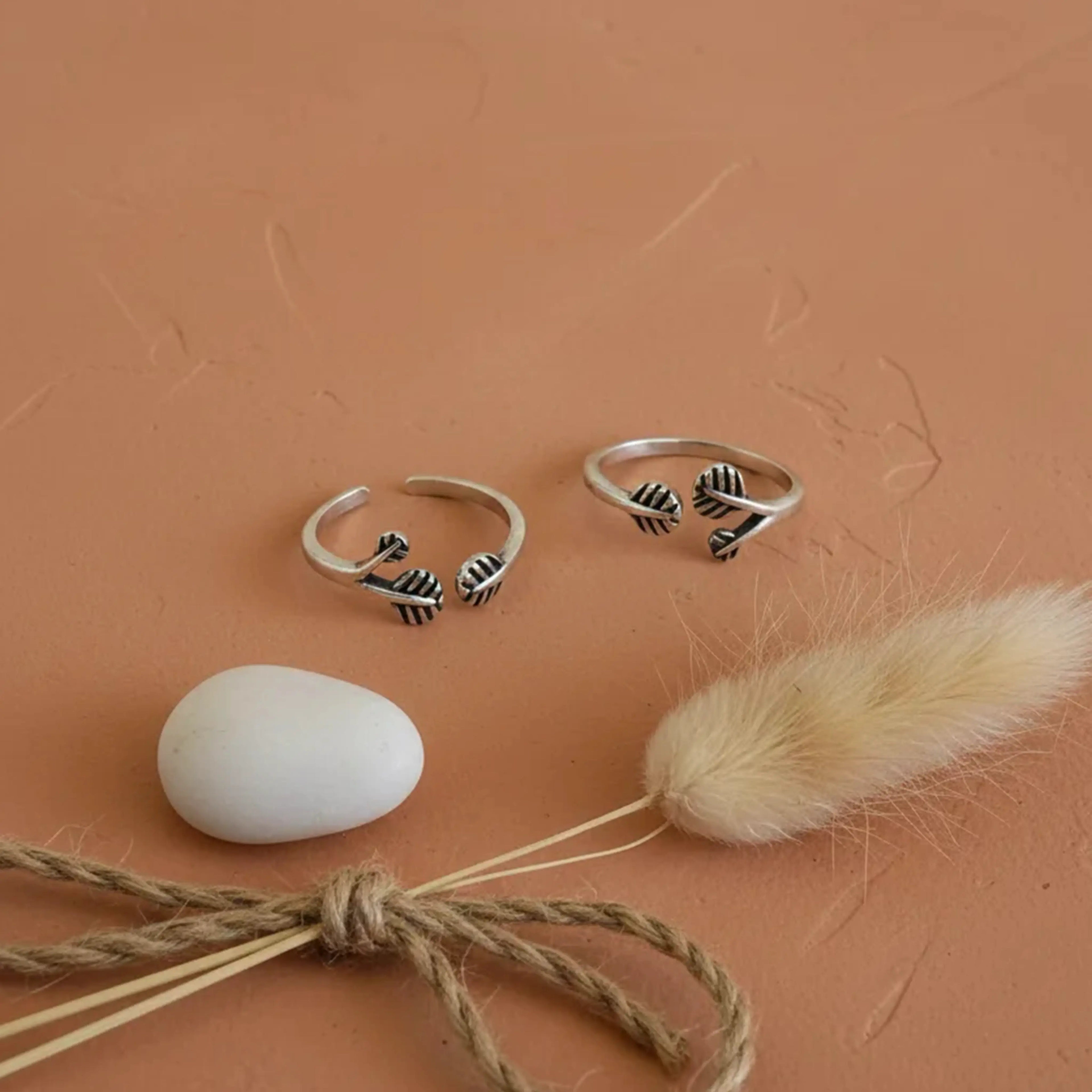 Triple Leaf Open-Front Toe Rings on solid background