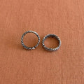Multi-Textured Oxidized Twist Toe Rings on solid background
