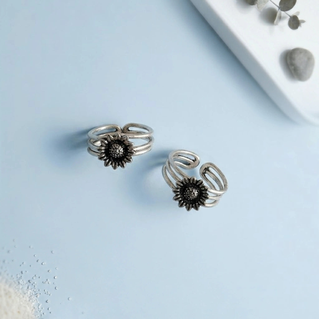 Sunflower Multi-Strand Oxidized Toe Rings on solid background