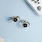 Sunflower Multi-Strand Oxidized Toe Rings on solid background