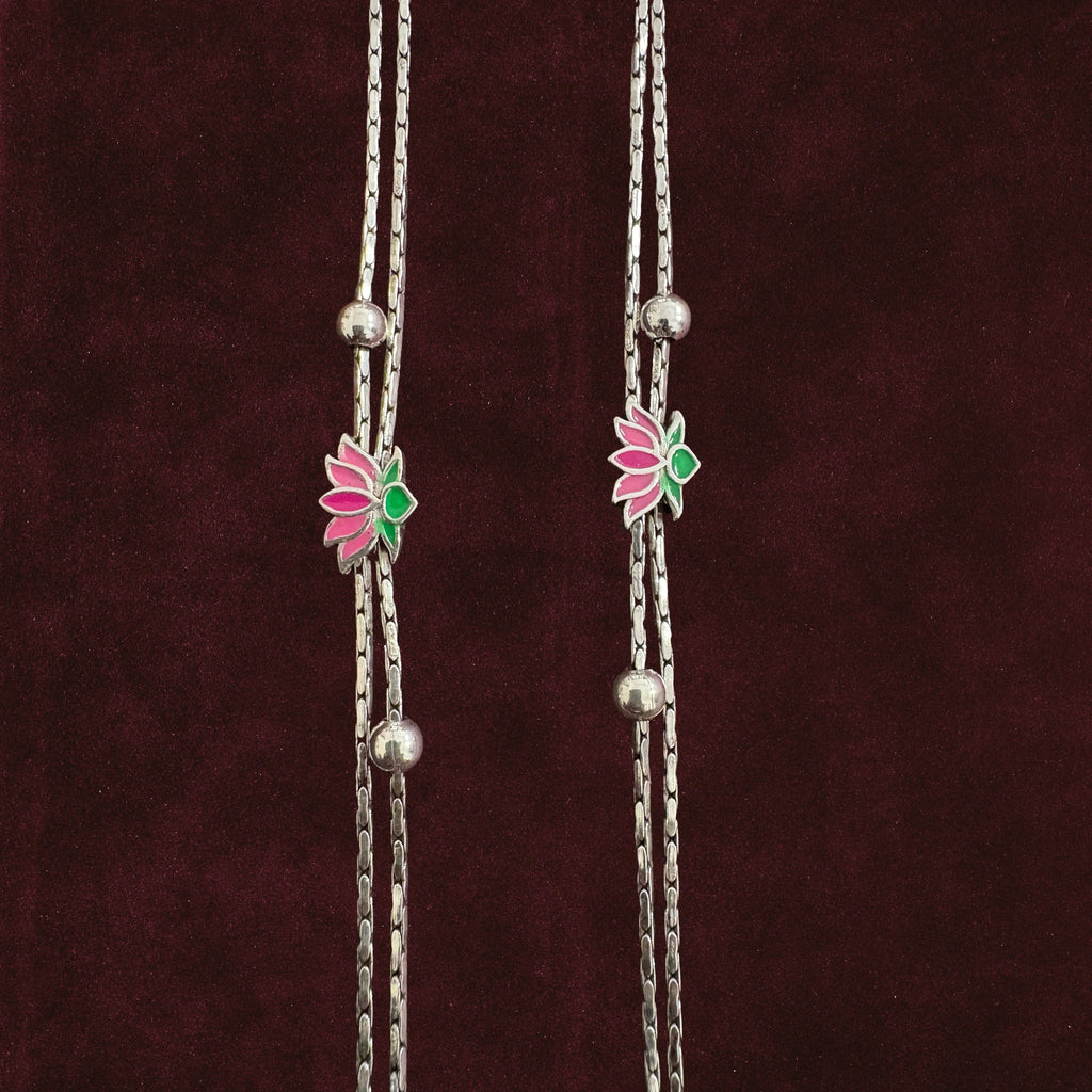 Close up of Twin-Strand Lotus Bloom Anklet Pair on maroon background