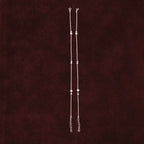 Silver Beads Anklet Pair on maroon background