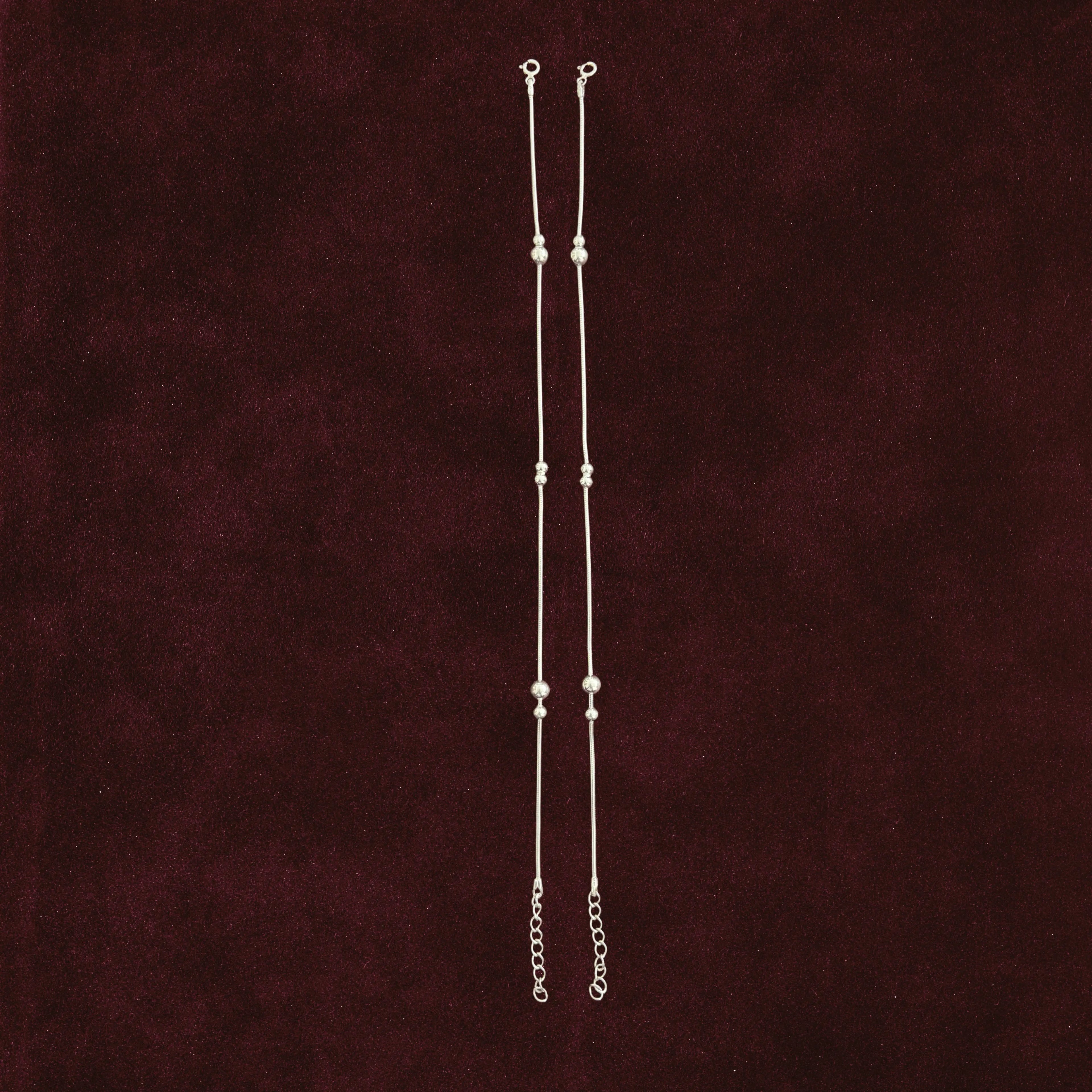 Silver Beads Anklet Pair on maroon background
