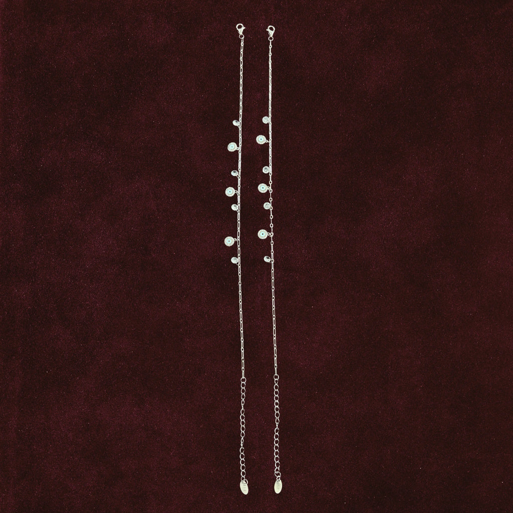 Aura Guard Charm Anklet Pair on maroon background