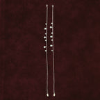 Aura Guard Charm Anklet Pair on maroon background