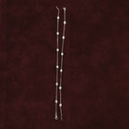 Sculpted Oval Link Anklet Pair on a maroon background