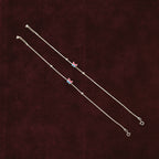 Fluttering Dual-Tone Butterfly Anklet Pair on a maroon background