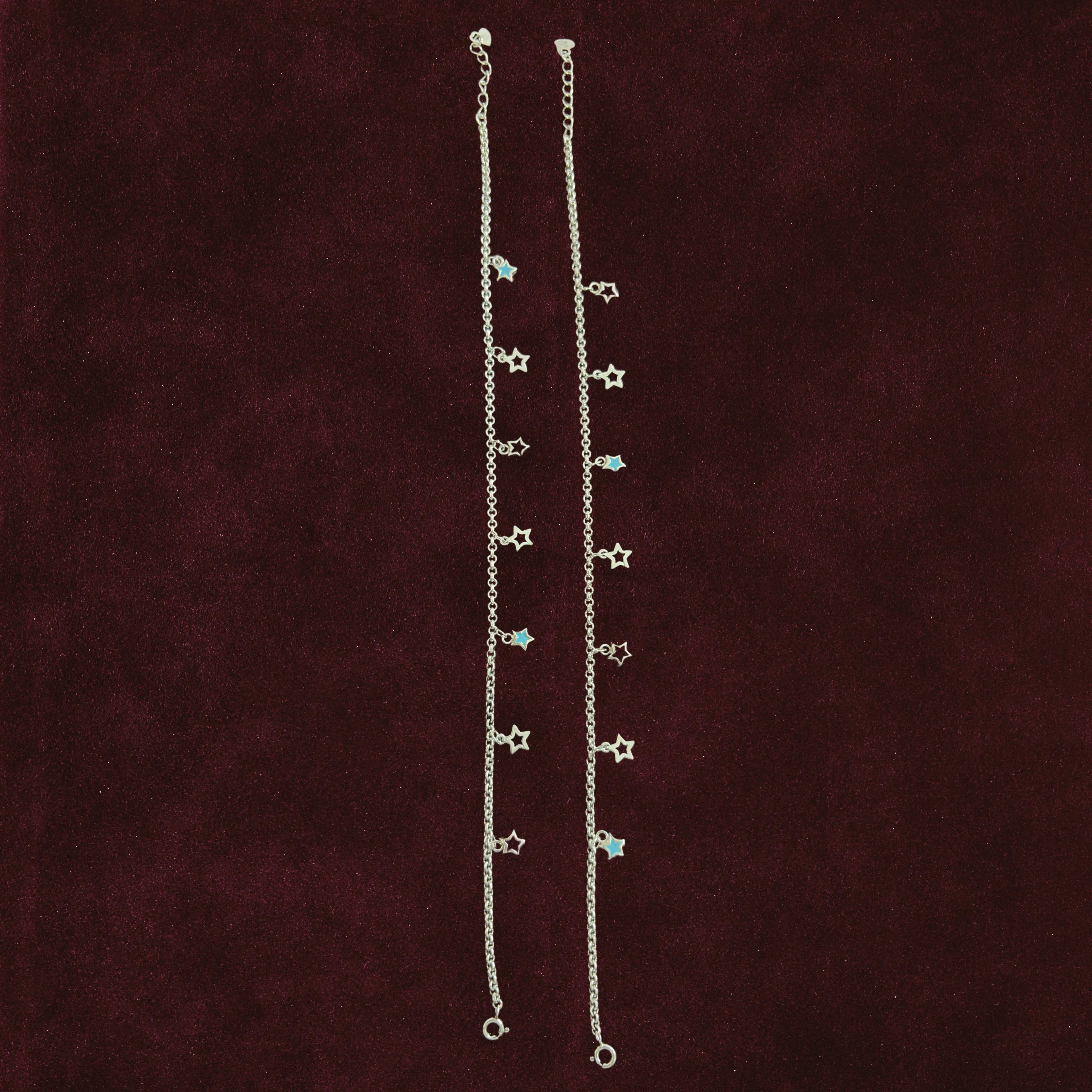 Starlit Charm Anklet Pair on a maroon background