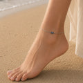 Close up image of Indian model wearing Sapphire Evil Eye Anklet