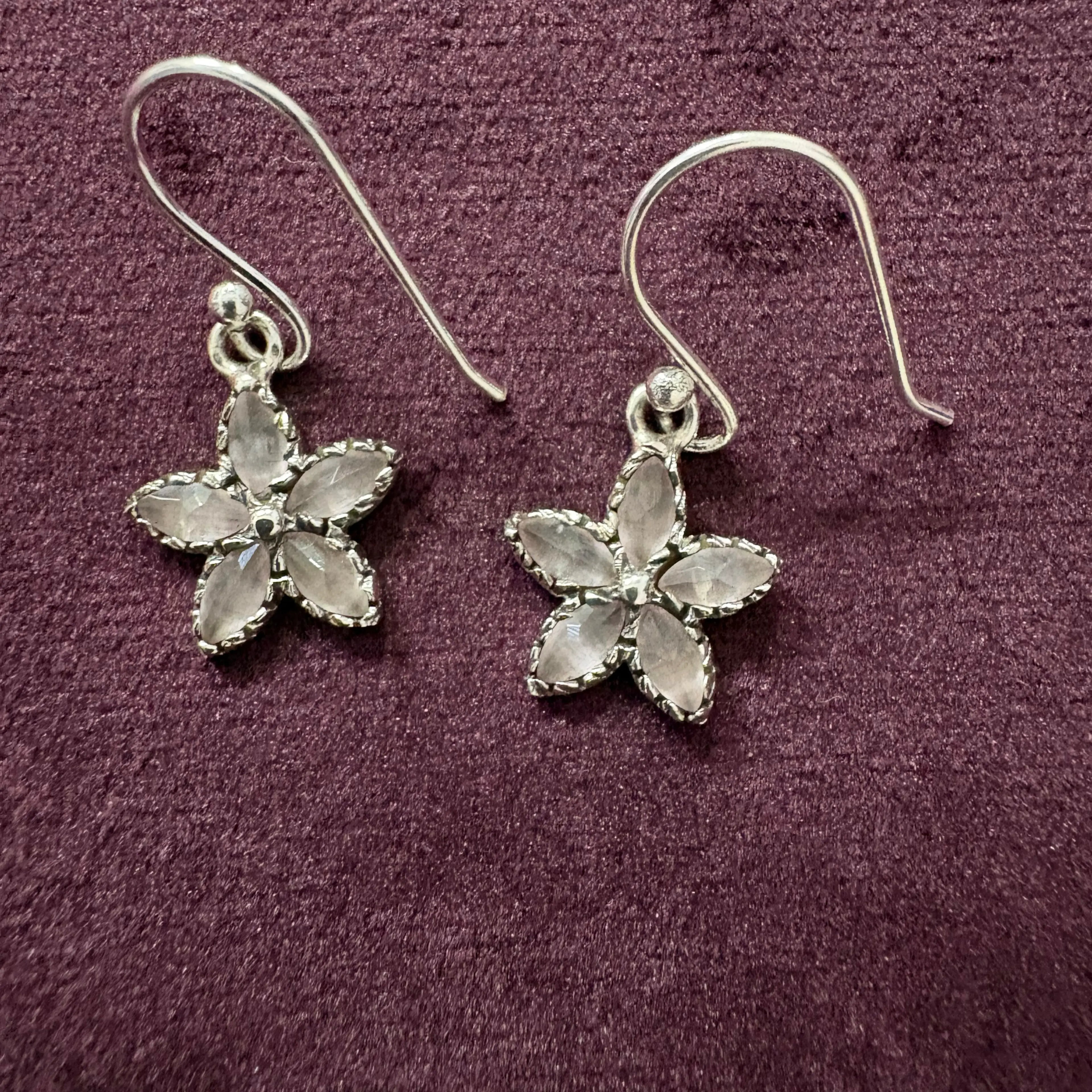Crystal Bloom Sterling Silver Earrings on maroon background