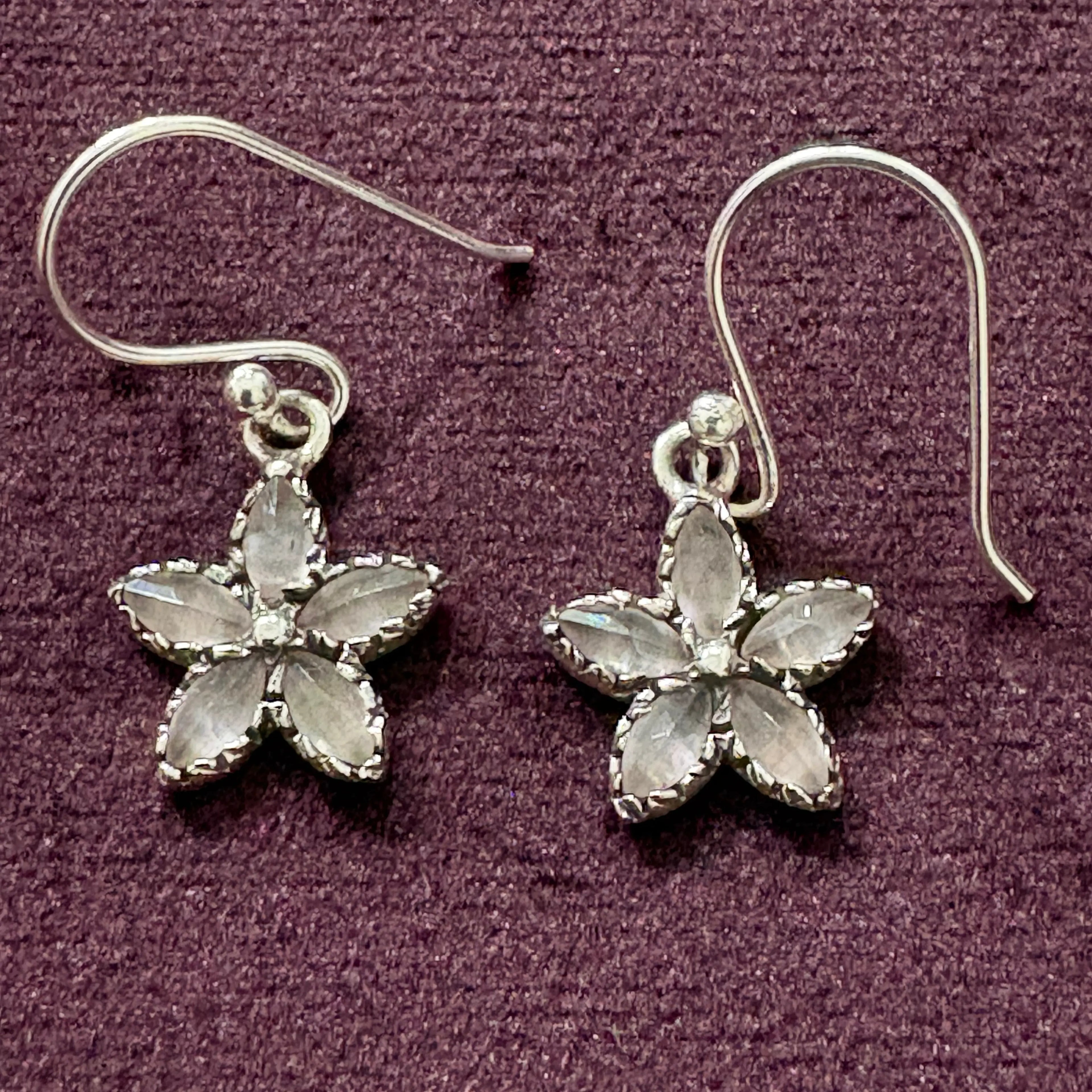 Crystal Bloom Sterling Silver Earrings on maroon background