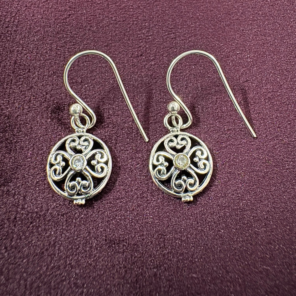 Ornate Filigree Sterling Silver Earrings on maroon background