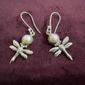 Pearl Dragonfly Sterling Silver Earrings on maroon background