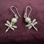 Pearl Dragonfly Sterling Silver Earrings on maroon background
