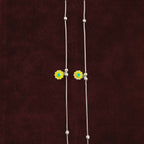 Close up of Sunflower Snake Chain Anklet Pair on maroon background