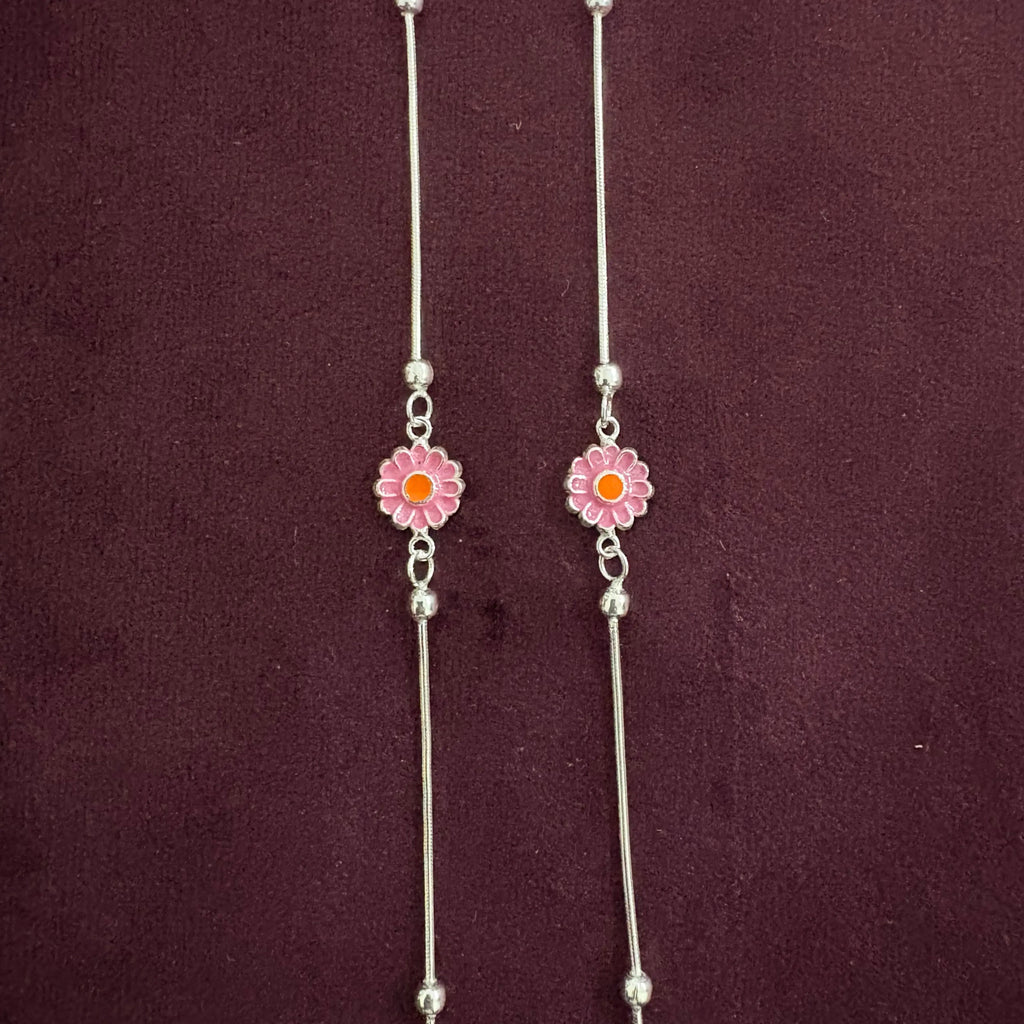 Radiant Daisy Anklet Pair close up on maroon background