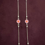 Radiant Daisy Anklet Pair close up on maroon background