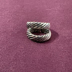 Multi-Textured Oxidized Twist Toe Rings on maroon background