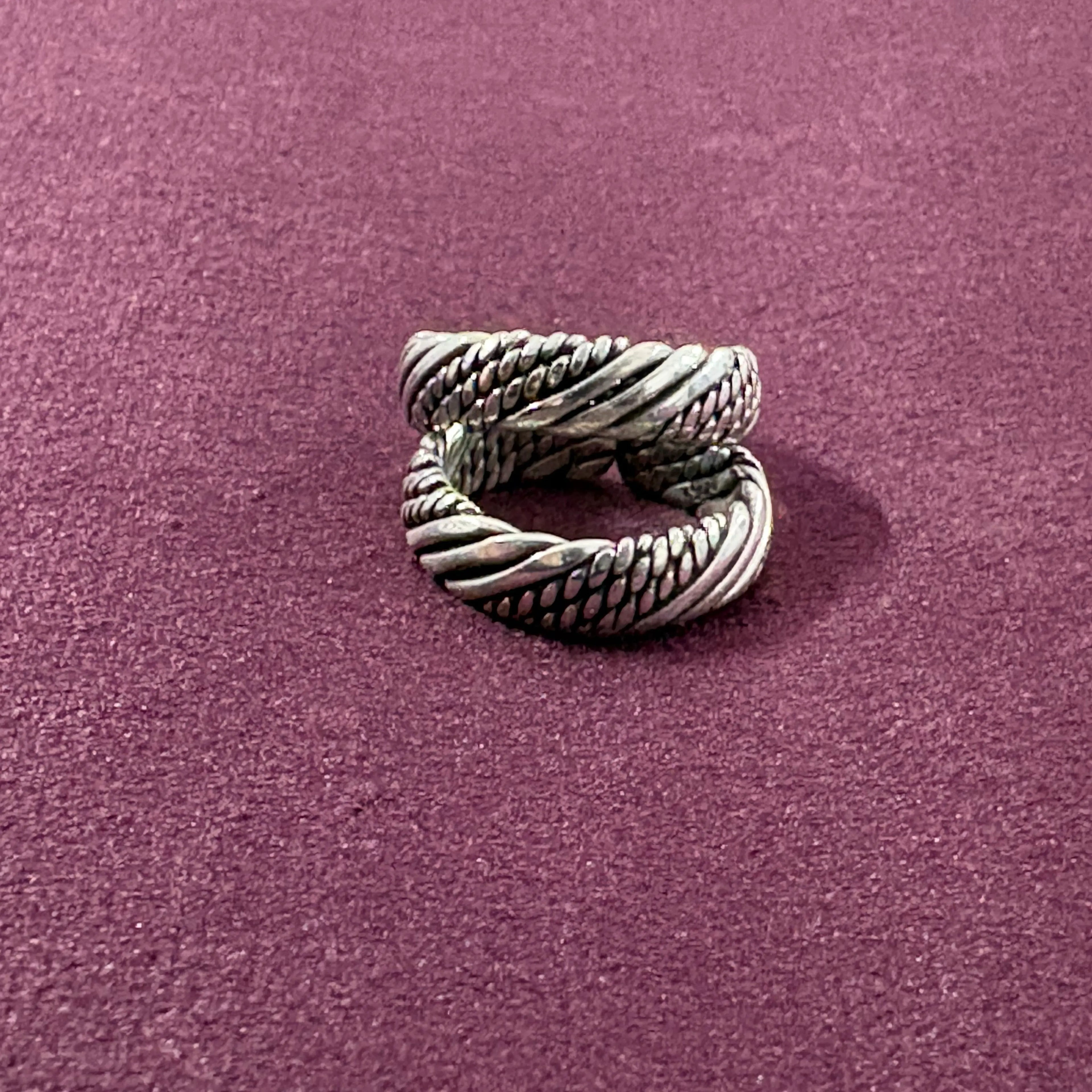 Multi-Textured Oxidized Twist Toe Rings on maroon background