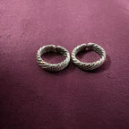 Multi-Textured Oxidized Twist Toe Rings on maroon background