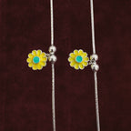 Close up of Sunflower Snake Chain Anklet Pair on maroon background
