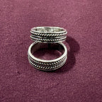 Classic Rope Band Toe Rings on maroon background