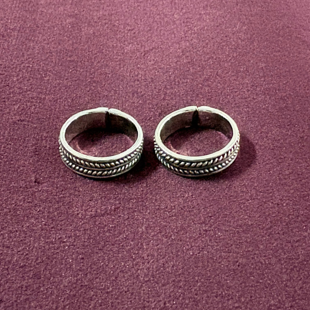 Classic Rope Band Toe Rings on maroon background