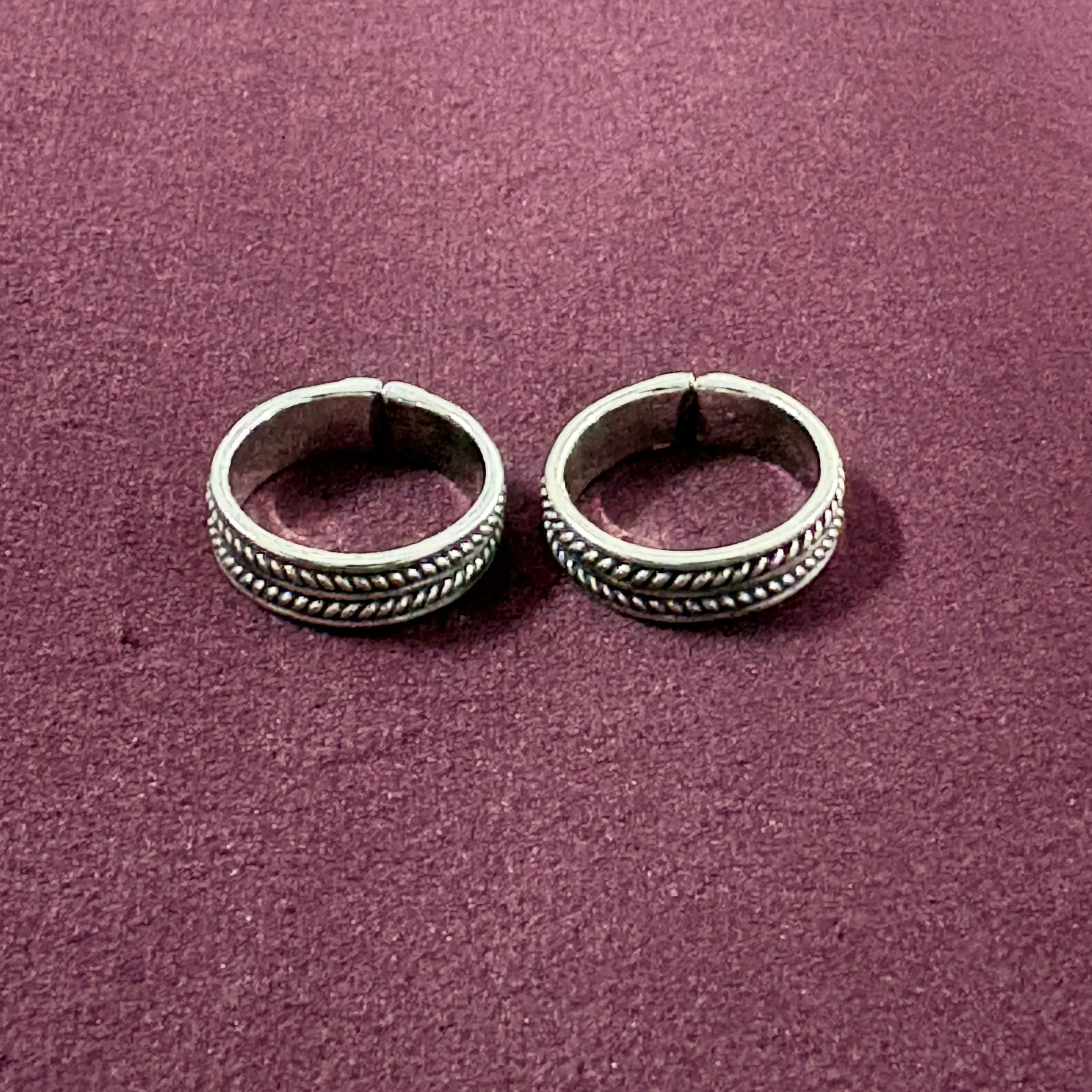 Classic Rope Band Toe Rings on maroon background