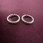 Sleek Grooved Band Toe Rings on maroon background