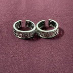 Garden Jaali Oxidized Toe Rings on maroon background