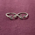 Triple Leaf Open-Front Toe Rings on maroon background
