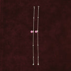 Pink Floral Anklet Pair on maroon background