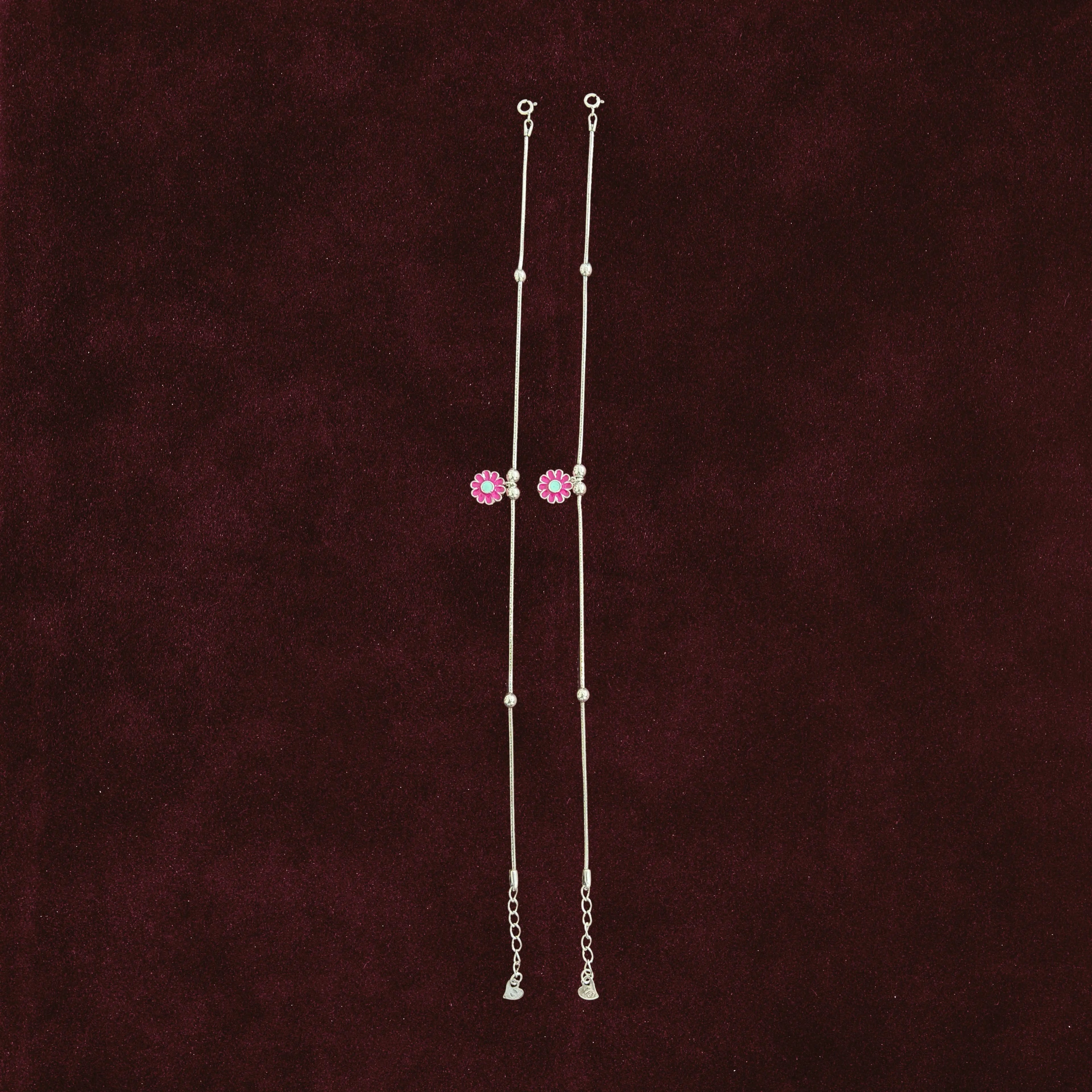 Pink Floral Anklet Pair on maroon background