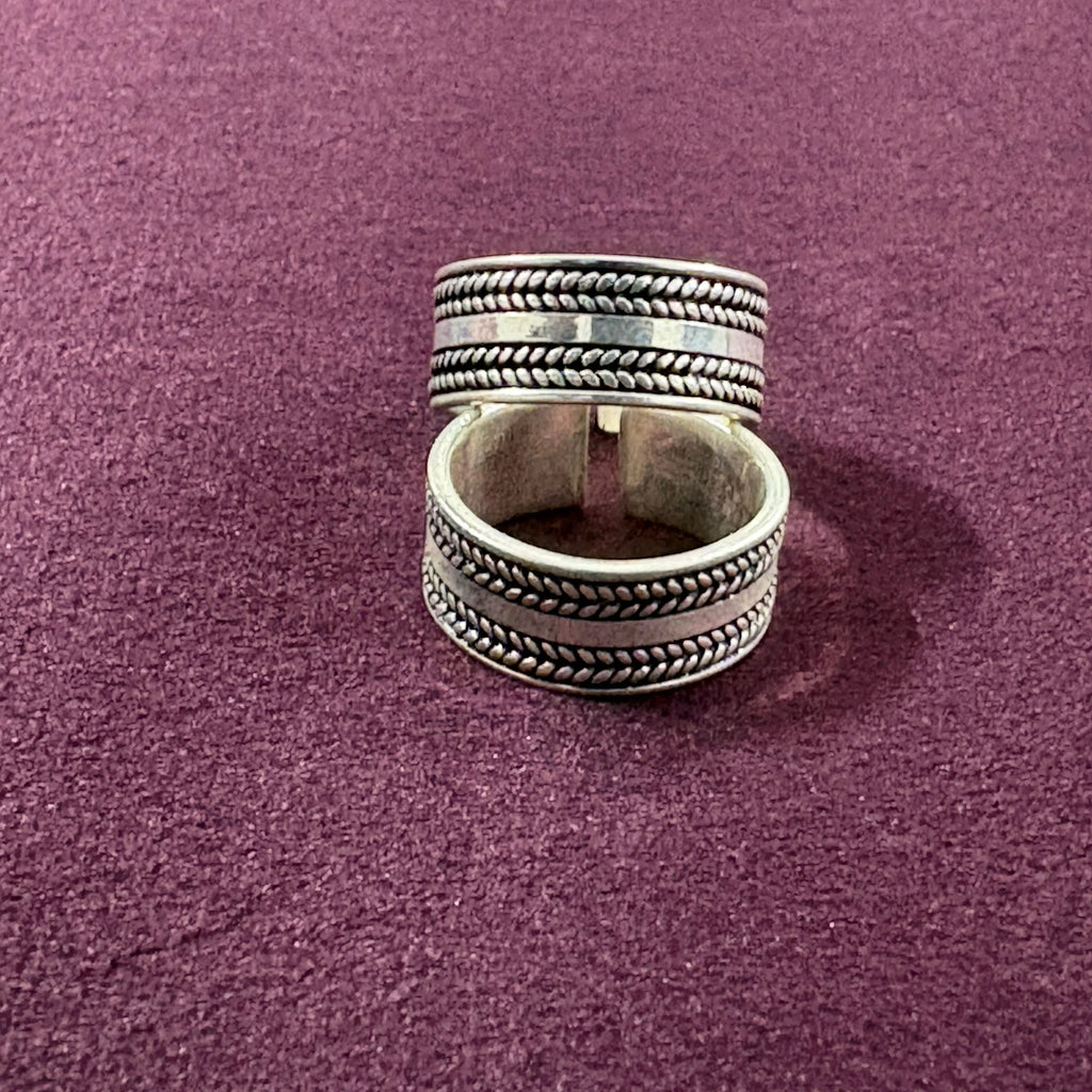 Braided Oxidized Band Toe Ring pair on maroon background
