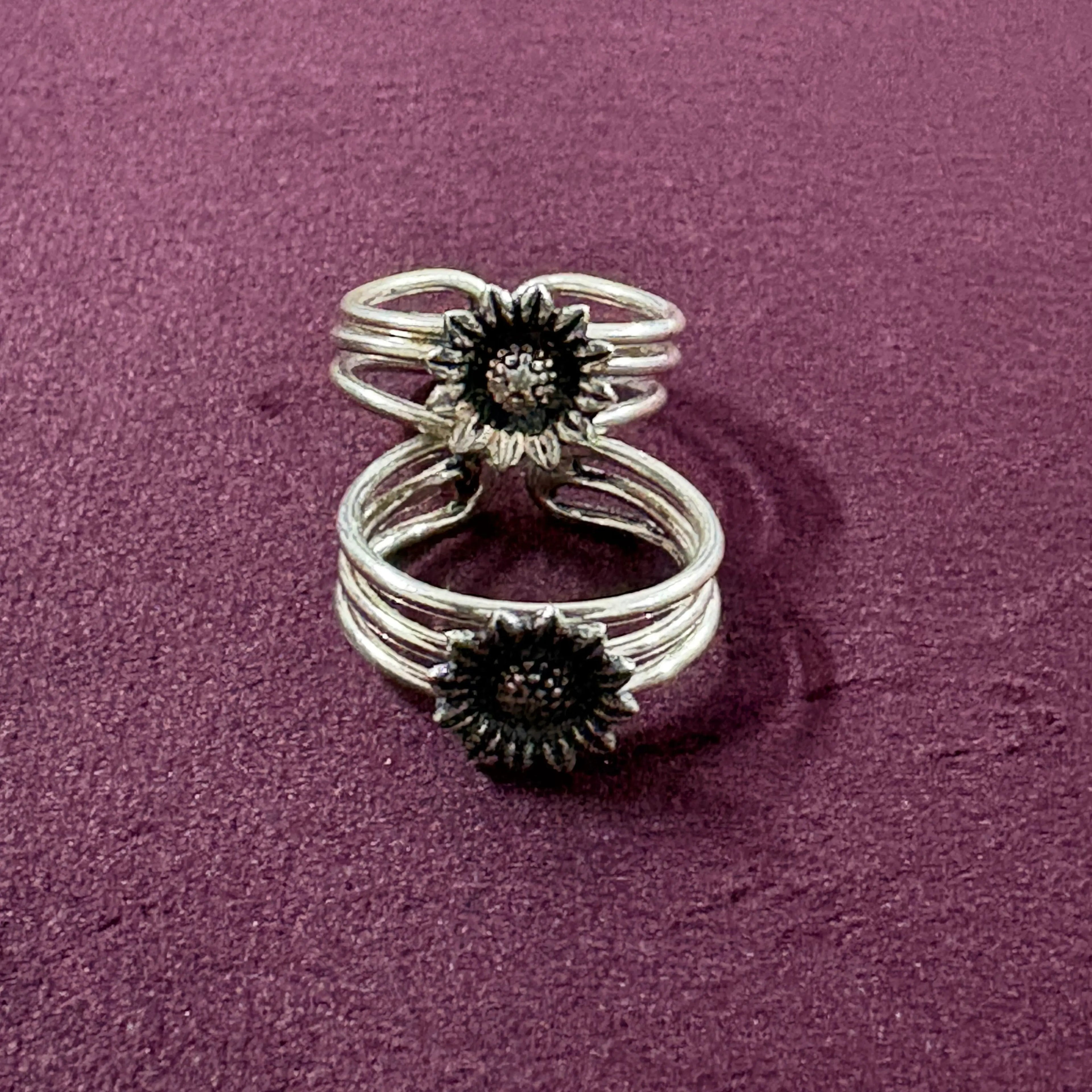 Sunflower Multi-Strand Oxidized Toe Rings on maroon background