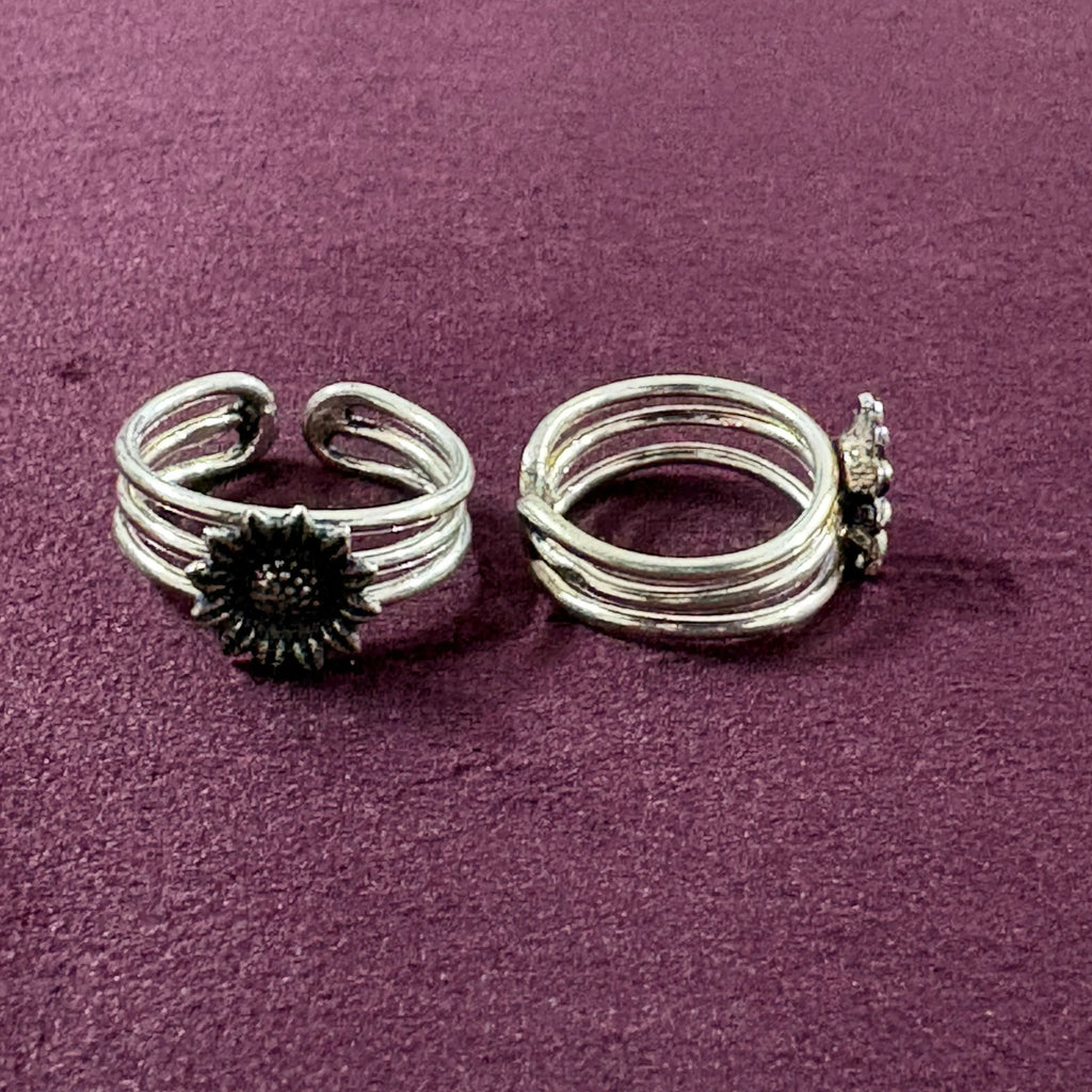 Flat lay image of Sunflower Multi-Strand Oxidized Toe Rings