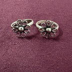 Wire Flower petal toe ring on maroon background