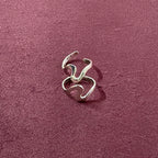 Flatly image of Ebb & flow toe ring pair on maroon backgroun