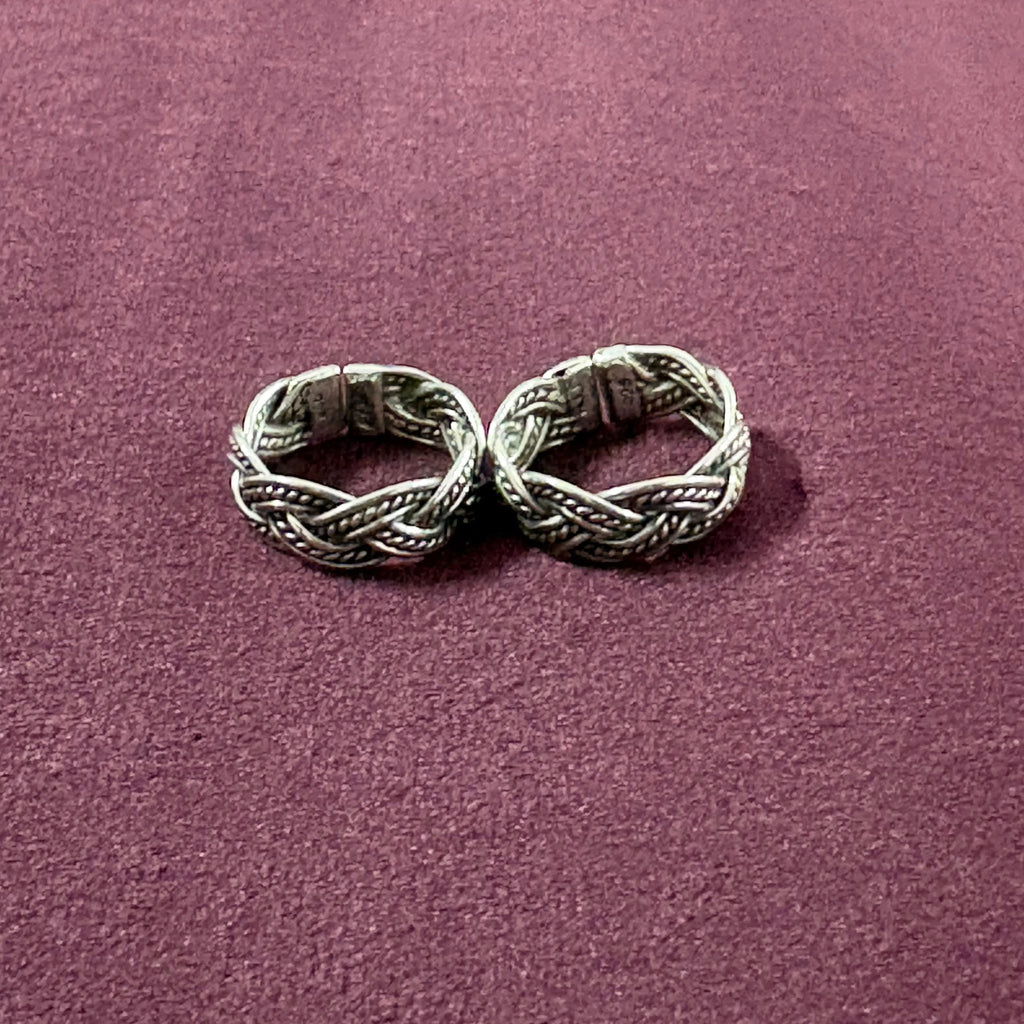 Braided Filigree Oxidized Band Toe Rings on maroon background