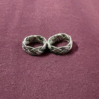 Braided Filigree Oxidized Band Toe Rings on maroon background