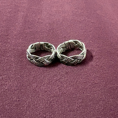 Braided Filigree Oxidized Band Toe Rings on maroon background