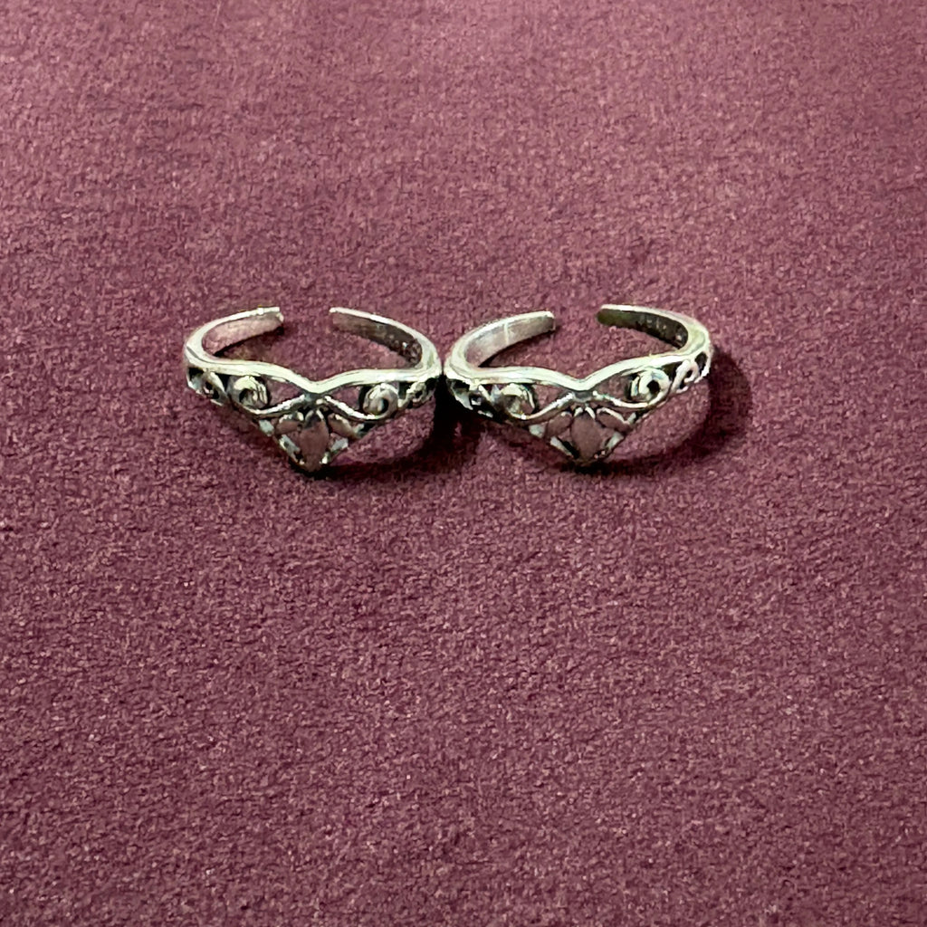 V-Shape Filigree Tiara Toe Rings on maroon background