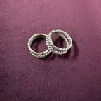 Twisted Double-Rope Oxidized Toe Rings on maroon background
