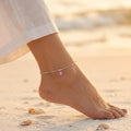 Close up of Indian female wearing Pink Floral Anklet 