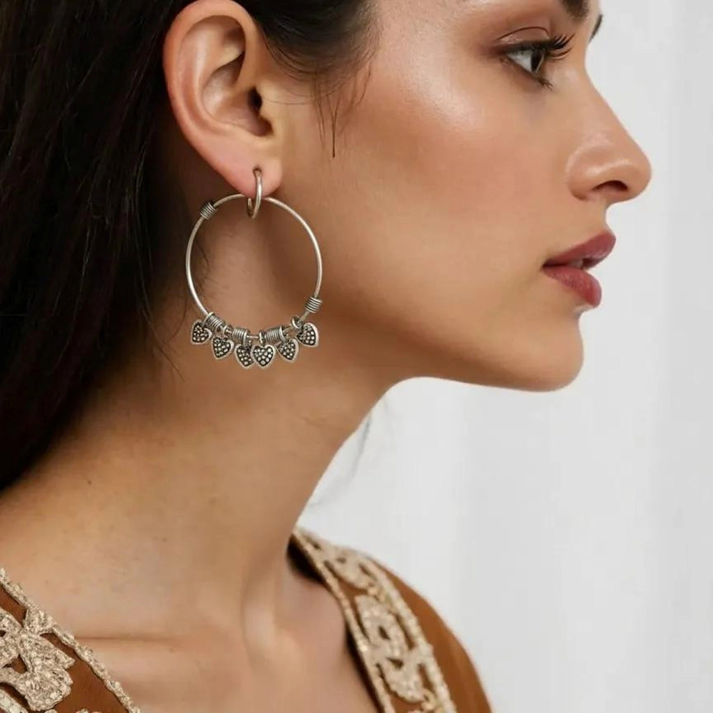 Sterling Silver Hoop Earrings with Heart Charms - Bhavya Silvers