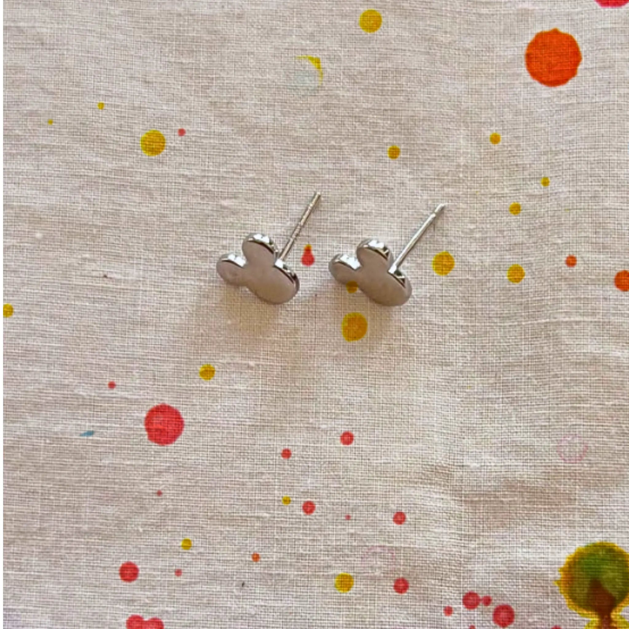 Pair of cartoon shaped stud earrings in green colored jewellery box 