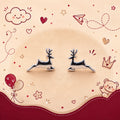 A pair of silver deer stud earrings displayed on a beige circular background with cute red and pink cartoon doodles including hearts, stars, balloons, a cloud, and a teddy bear.